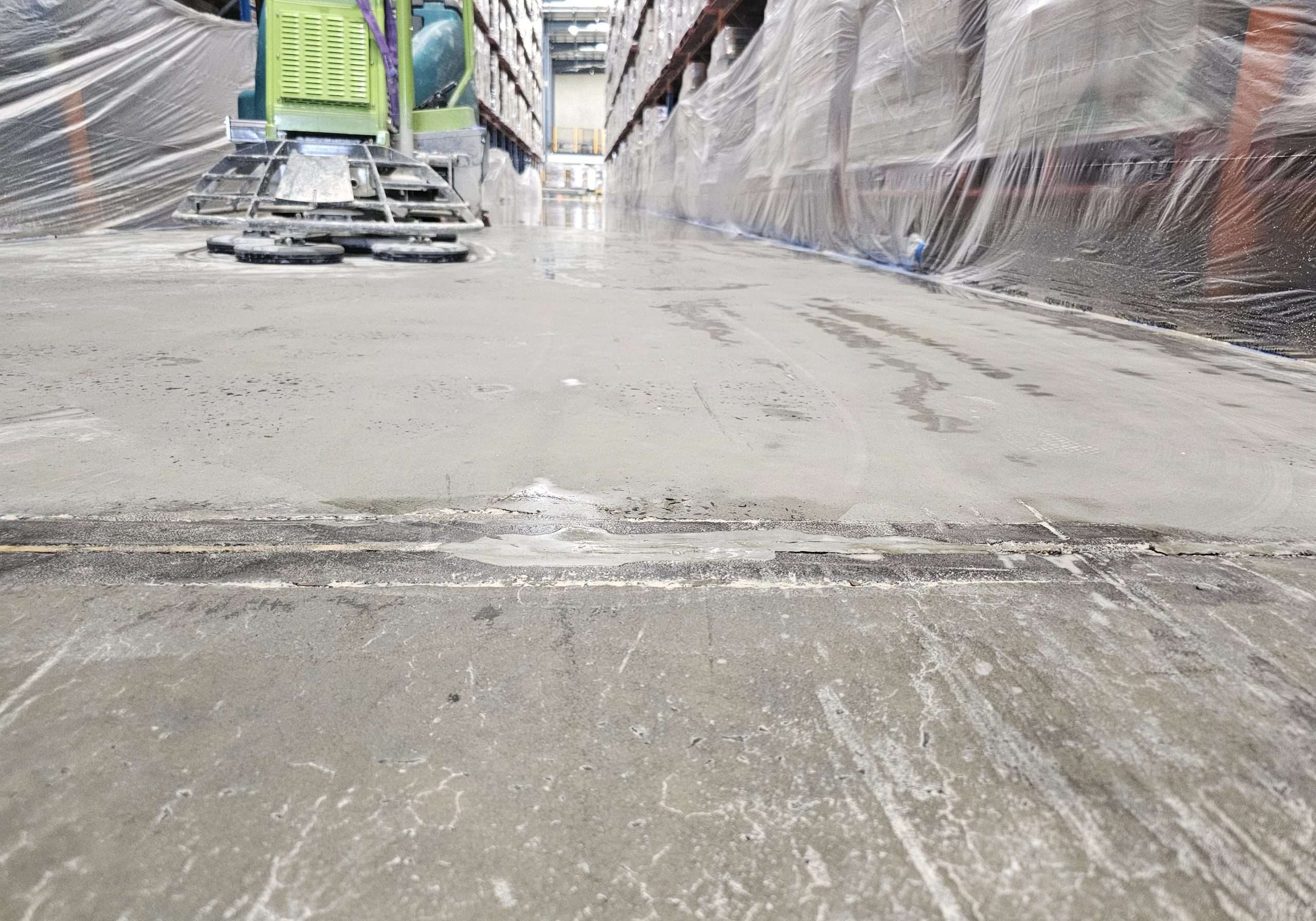 Badly damaged warehouse before joint reconstruction